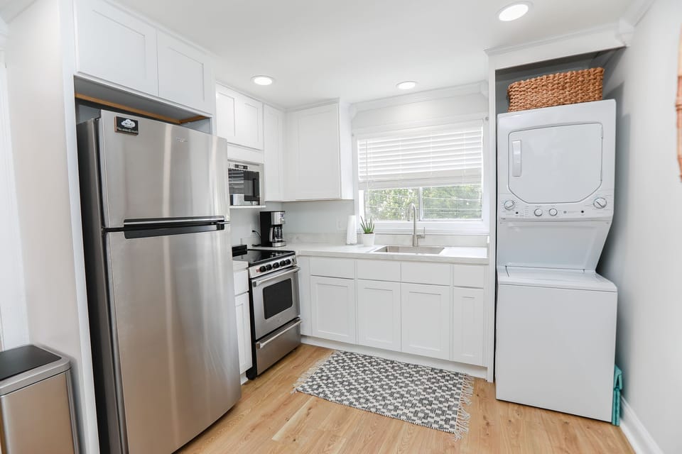 Kitchen with washer and dryer.