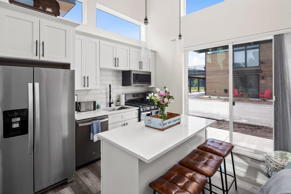 Fully stocked kitchen with both a drip pot coffee maker and keurig.