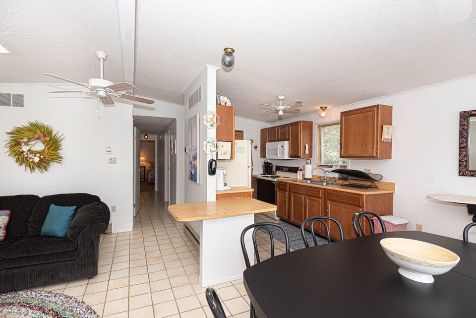 family/dining area and showing hallway to bathroom and bedrooms
