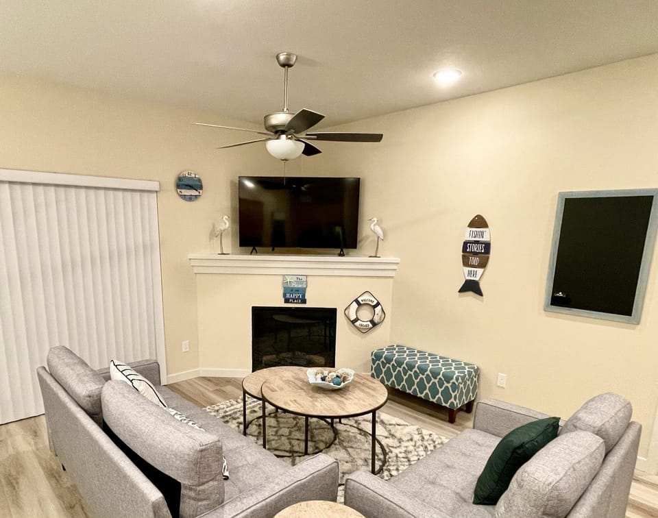 Living room with smart tv, fireplace