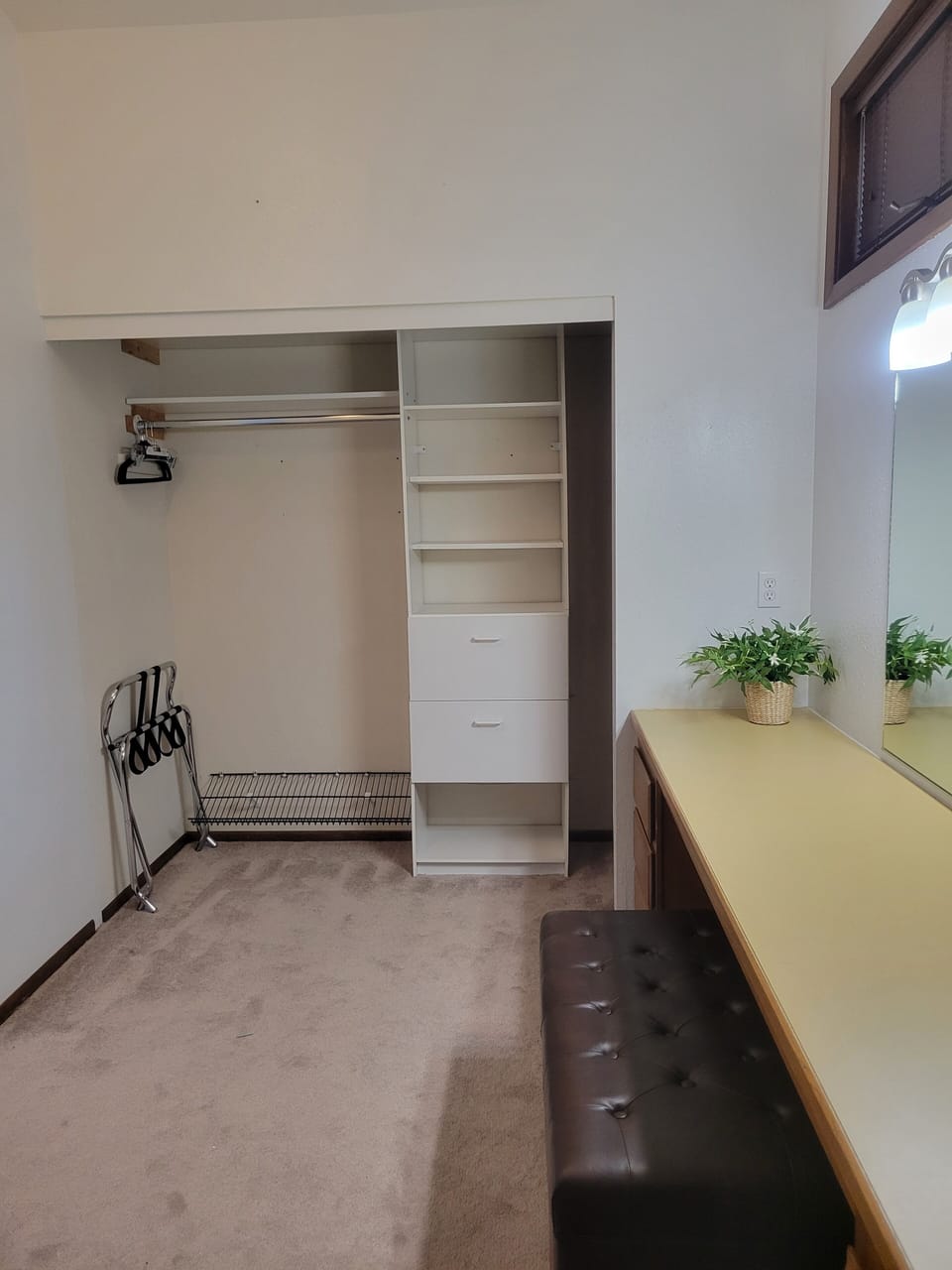 Large double closets (both sides), dressing area with mirror, lighting and bench