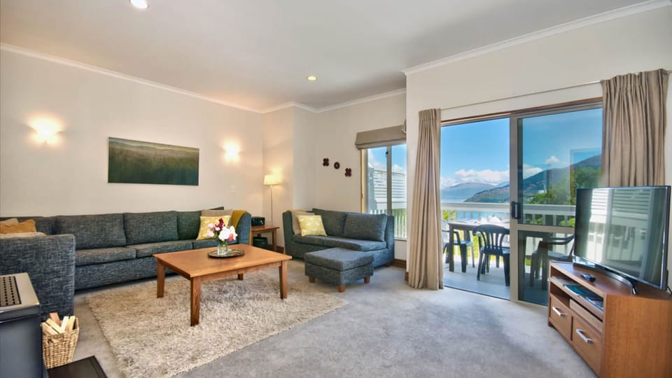 Large lounge which opens up onto balcony
