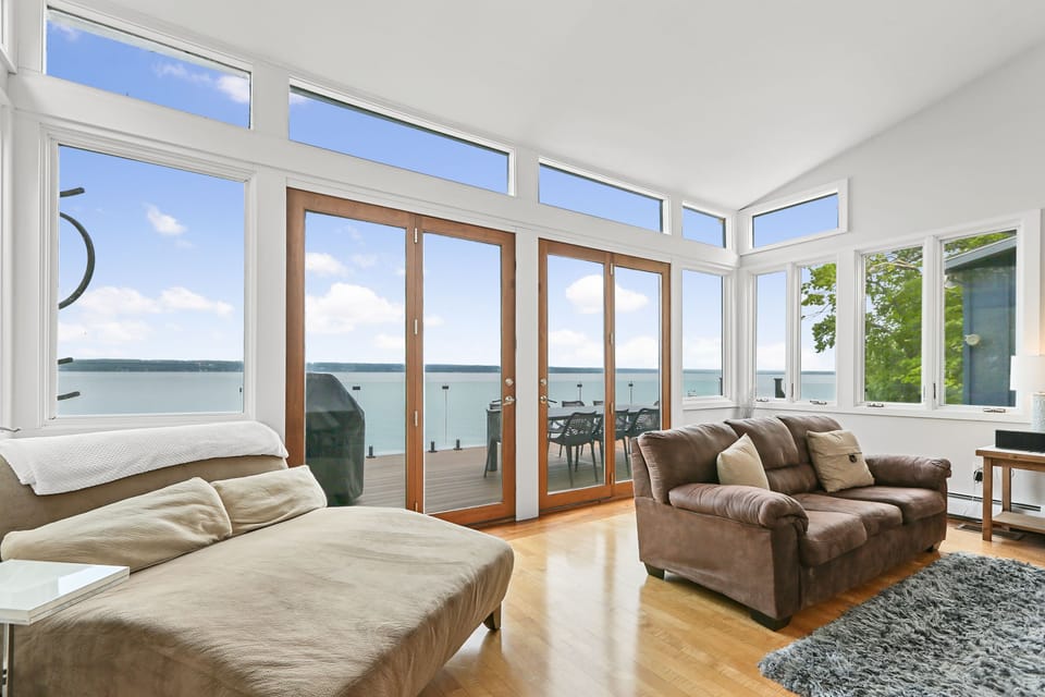 Huge Living Room sitting area connects to the deck & the kitchen w/ great views