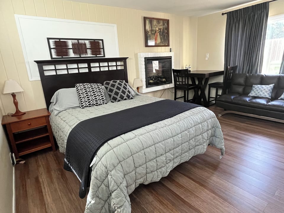 Enjoy your evenings in a comfortable queen bed next to the electric fireplace.