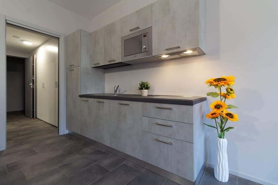 Kitchen apartment  Girasole Affitti Brevi Italia near the historic center. Ideal for couples or business stays. Kitchenette equipped and furnished with every comfort. wifi free laundry including parking nearby

