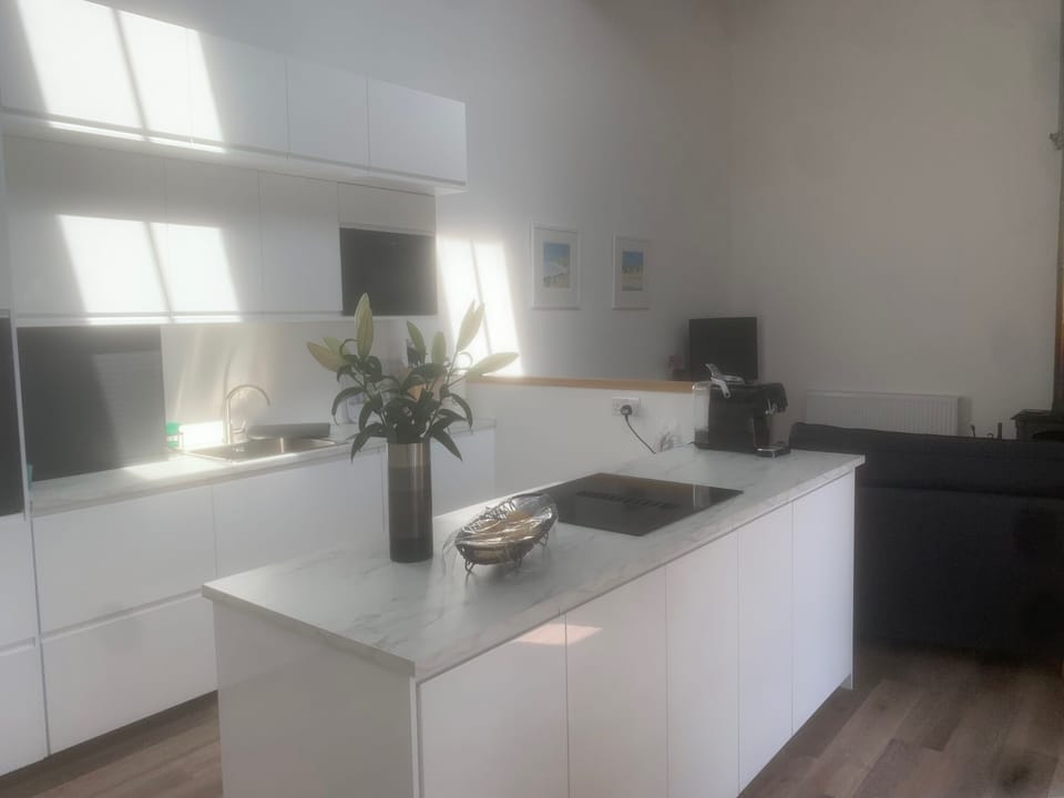Kitchen looking into sitting room space
