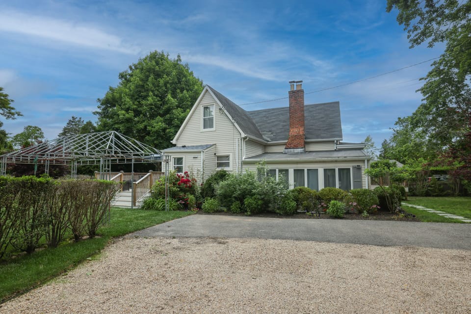 House from gravel drive view