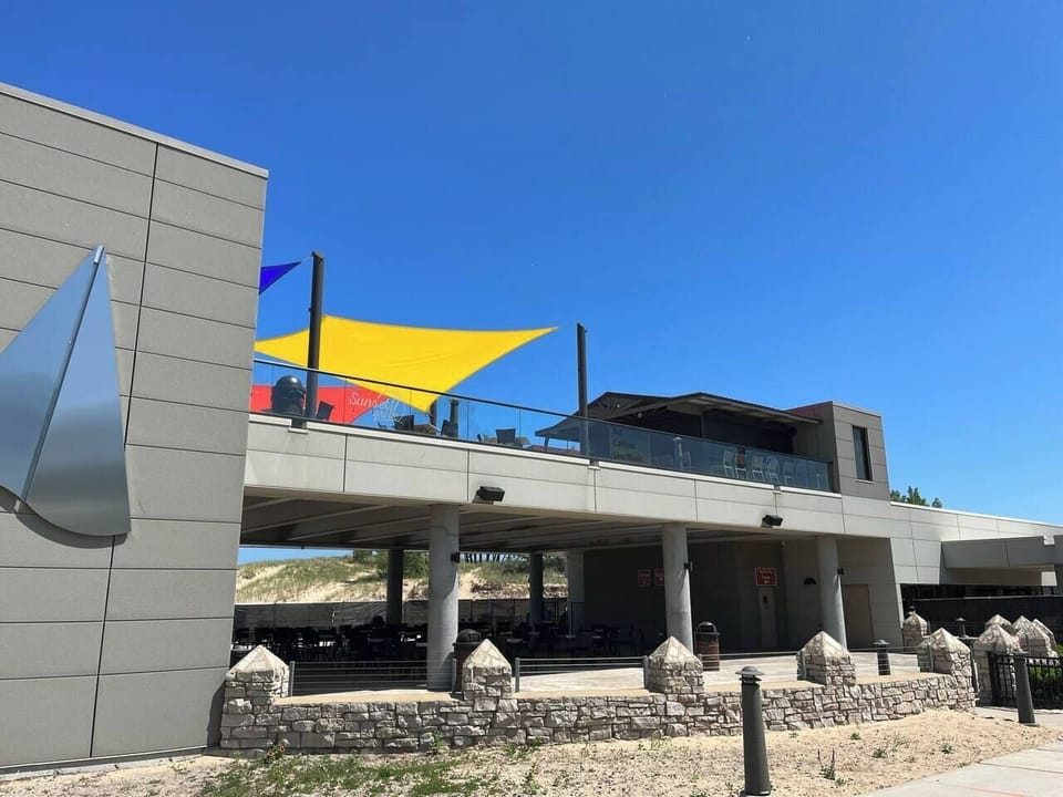 Sunset Grill, a rooftop restaurant/bar overlooking Lake Michigan, is located near Washington Park Beach less than a mile from Blue Chill Hideaway.