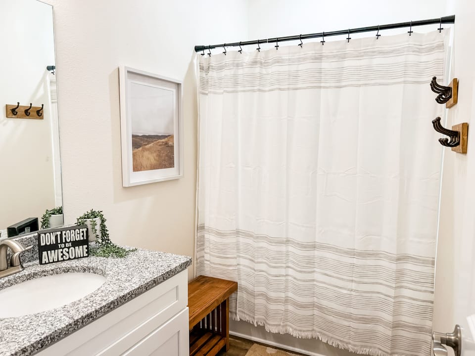 Bathroom 2 is directly between Bedroom 2 and Bedroom 3 with a tub/shower combo!