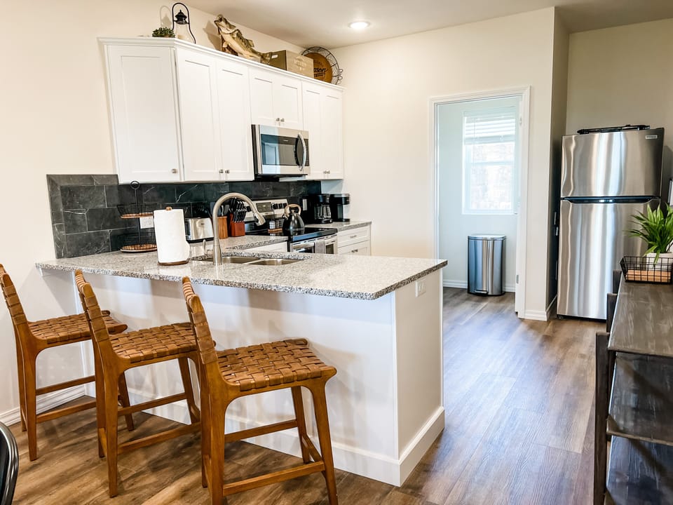 Granite countertops, stainless steel appliances, and 2 coffee makers!