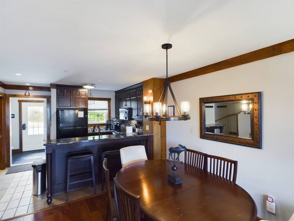 Dining room / kitchen with bar.