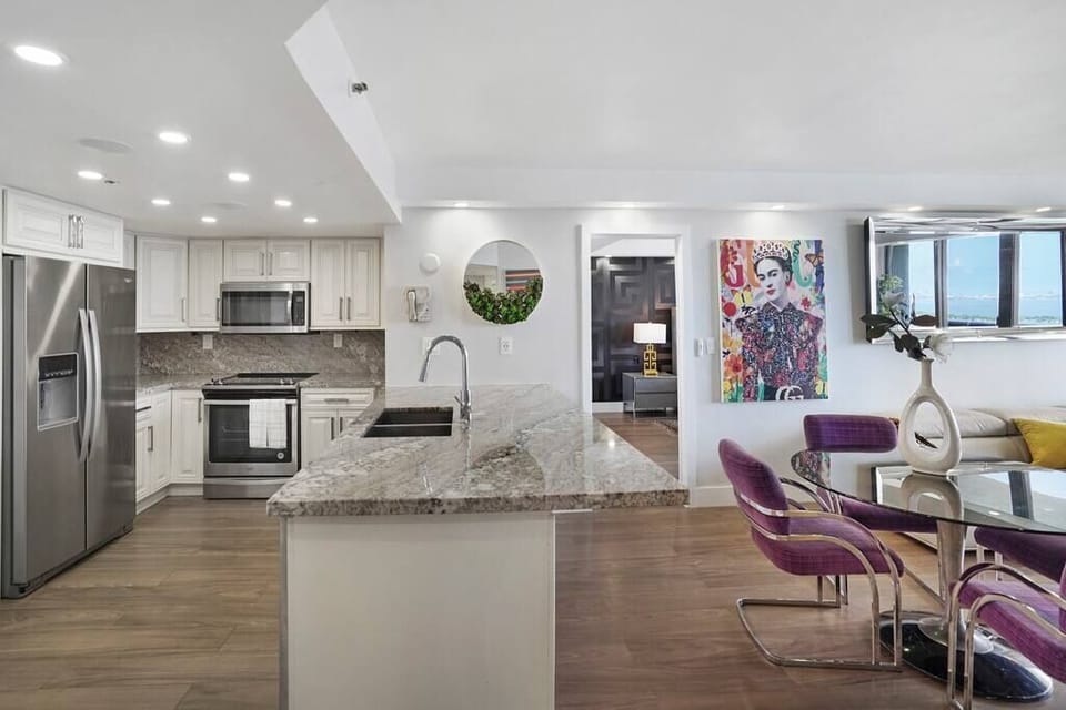 Fully equipped kitchen, dining area, straight ahead is master bedroom suite