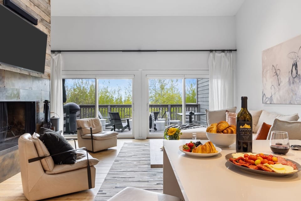 Kitchen looking into Living Room and Private Patio