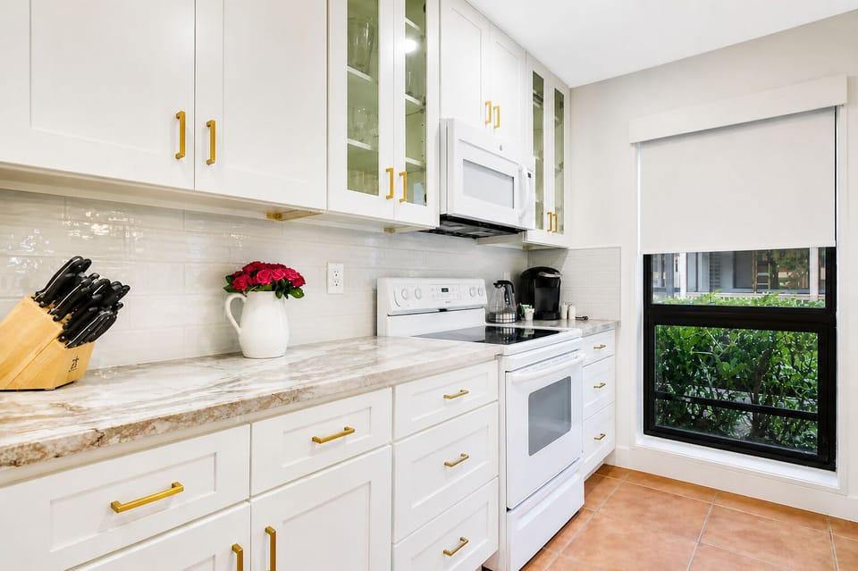 Bright, updated, fully equipped kitchen with modern finishes.  