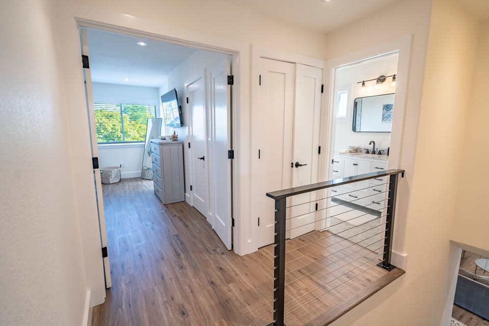 Upstairs hallway to master bedroom and shared bathroom
