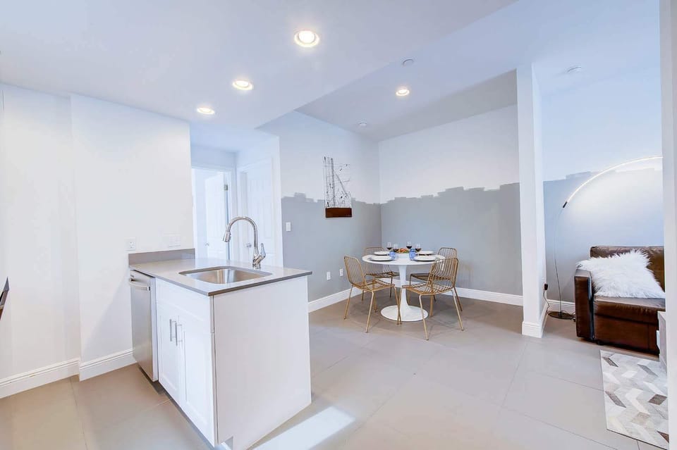 Kitchen to the left, dining area to the back, and living room to the right. 