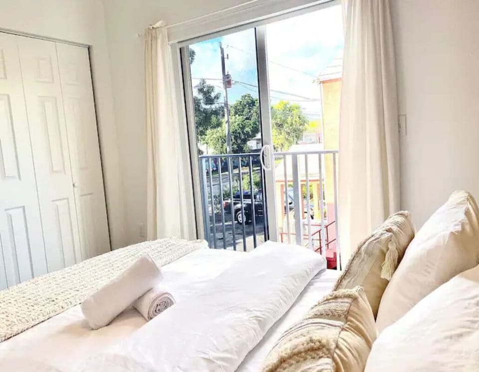Bedroom with a queen bed, a closet, a private bedroom, and a private balcony!
