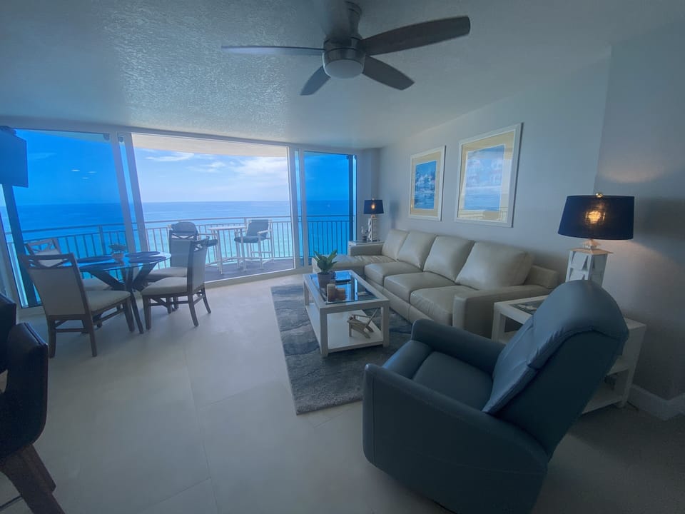 Beautifully decorated living room with panoramic oceanfront views.