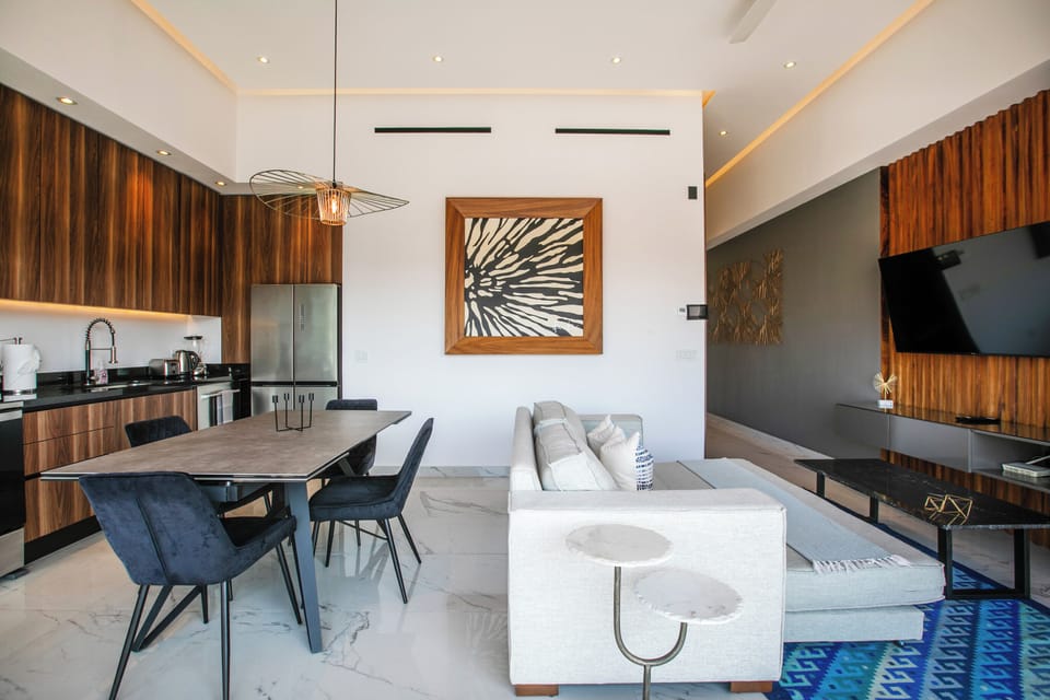 Open layout of living, dining area and kitchen
