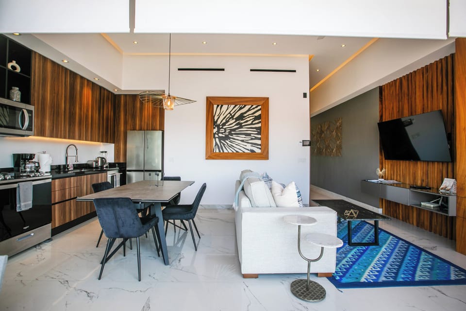 Step into your sleek modern sanctuary with gleaming marble floors, rich wood accents, and an open-concept design perfect for relaxing.