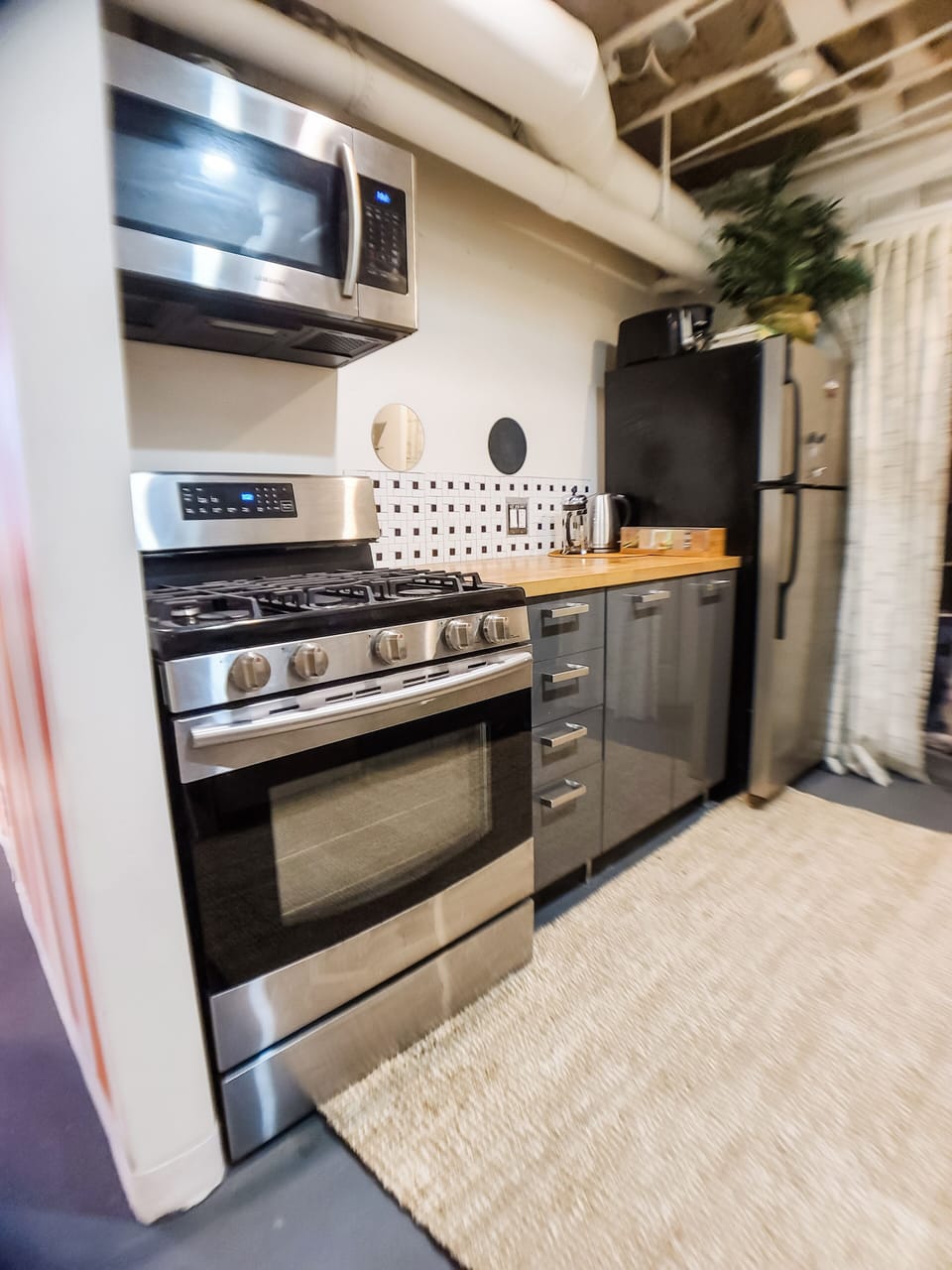 Gas stove and oven, full sized refridgerator.