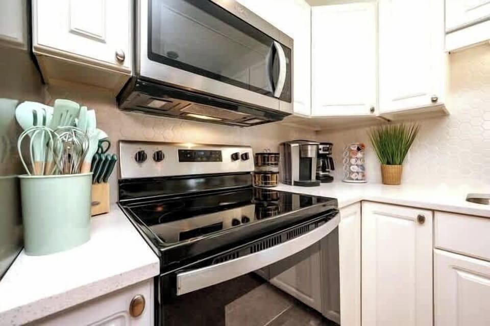 We've stocked this kitchen with full appliances, dishes, bake ware, pots & pans, silverware, utensils, crockpot, blender, and a traditional coffee maker & Keurig!