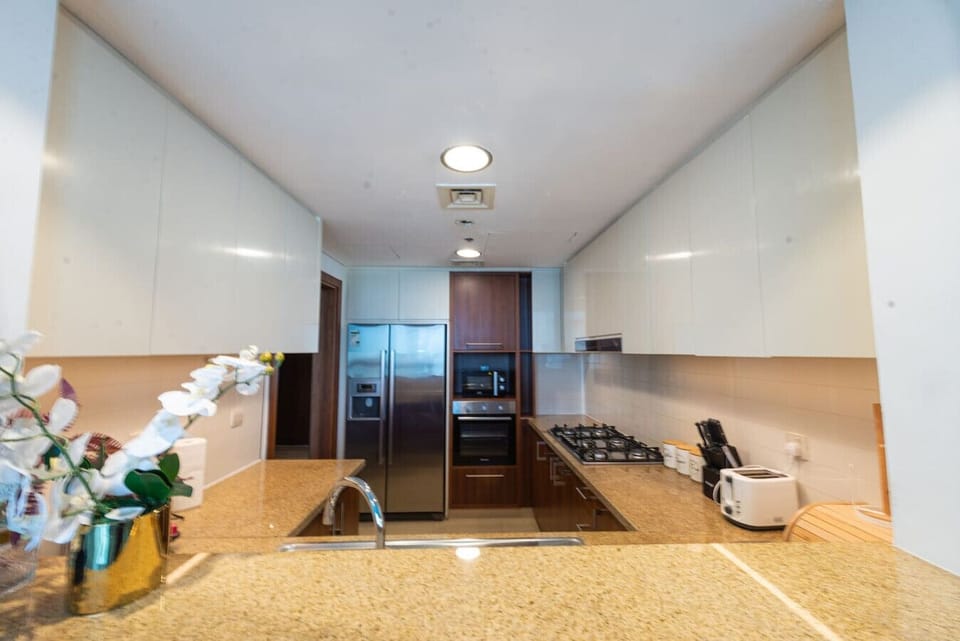 Gourmet Kitchen: Whip up culinary delights in this sleek, modern space with top-notch appliances!