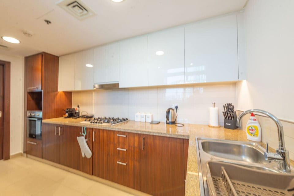 Kitchen: Whip up culinary delights in this sleek, modern kitchen with top-notch appliances!