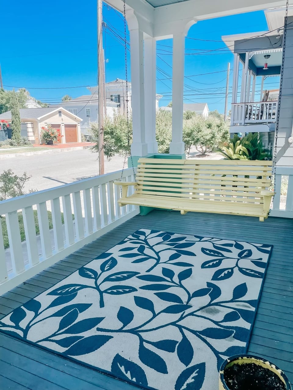 Enjoy a cup of coffee on the front porch swing
