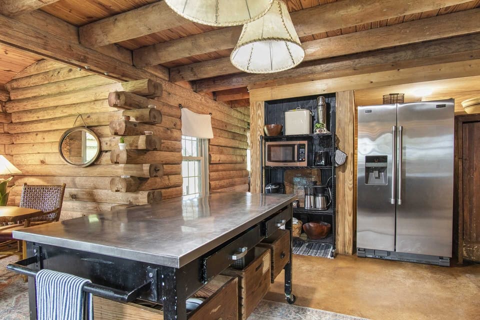 Modern appliances, along with cooking ware, utensils, glasses, and serving ware, make the full kitchen at Doe Creek a well-appointed culinary dream space!