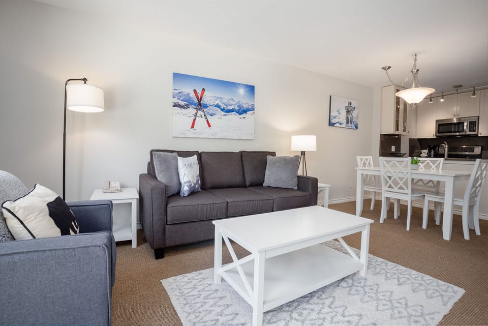 The living room features a cozy gas fireplace and comfy sofa for evening relaxation.