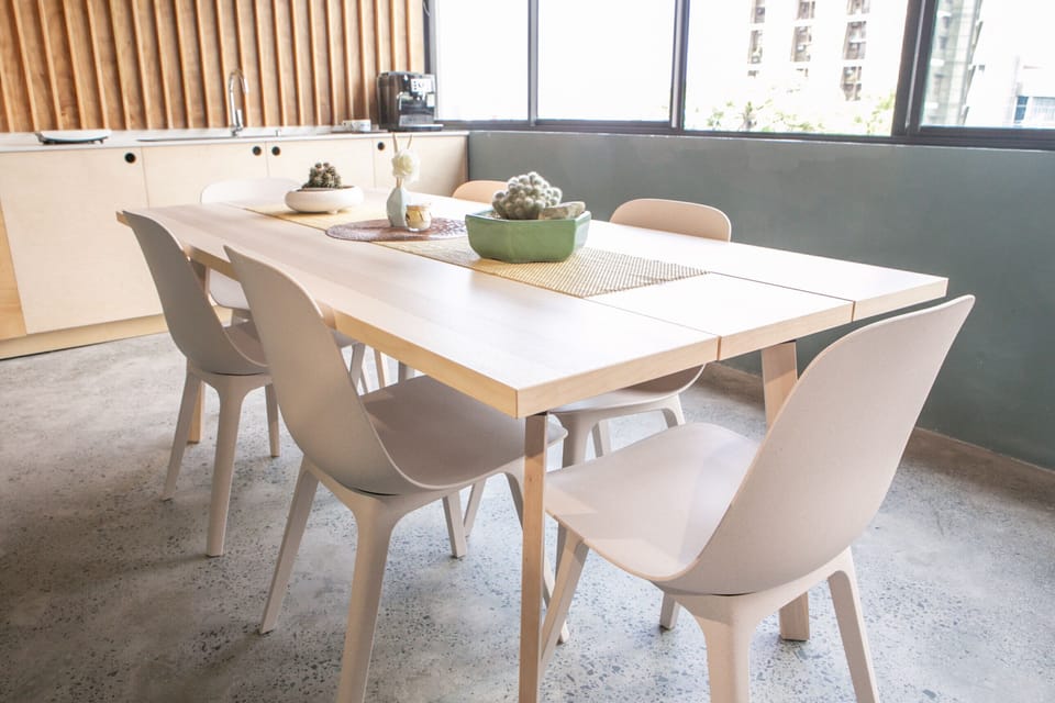 This large wooden table is good for 6, and only for the use of guests.