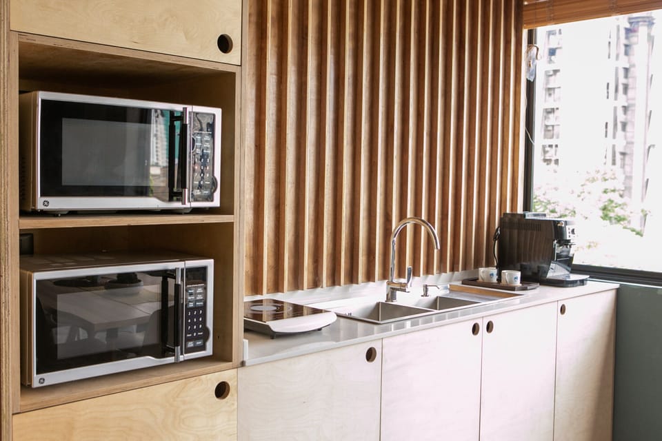 (L to R) Microwave, Stove, and Sink. Also comes with cookware and utensils.