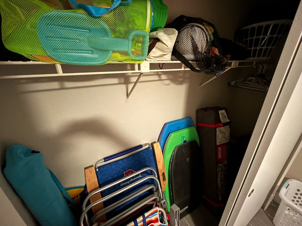 closed loaded with beach chairs, toys, tent, umbrella, games and pull carts