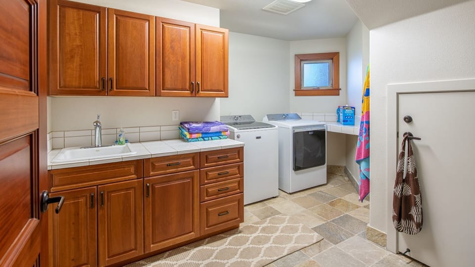 Laundry room with full size washer/dryer