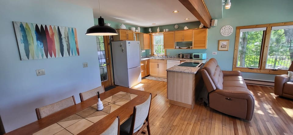 Open kichen/living room, over looking 
Torch Lake.