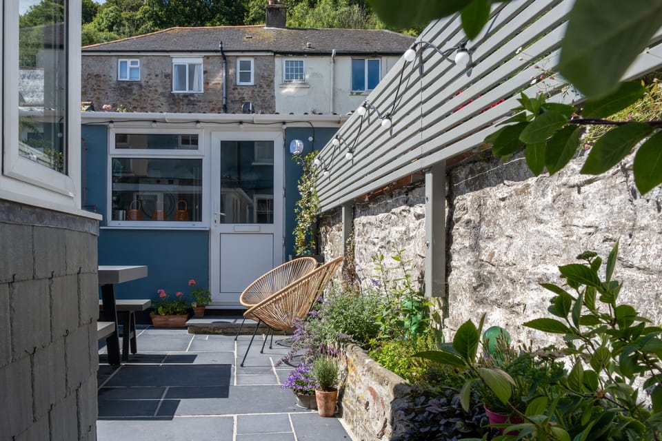 Our perfect sun trap courtyard garden, with an outhouse with washer/drier
