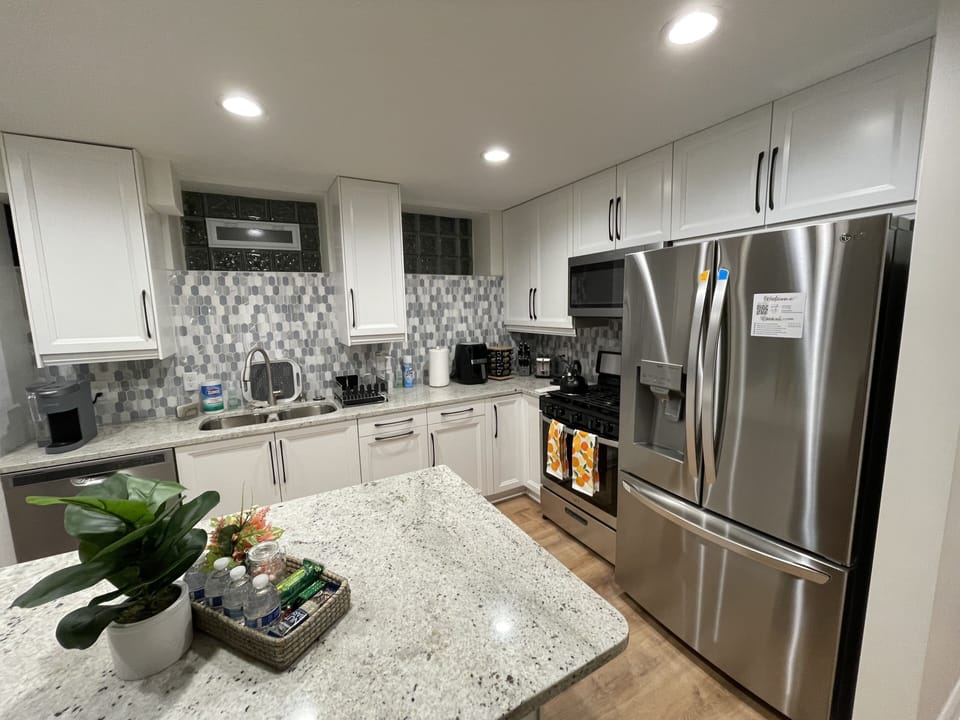 Stainless steel appliances: Note refrigerator w/ icemaker & water dispenser.