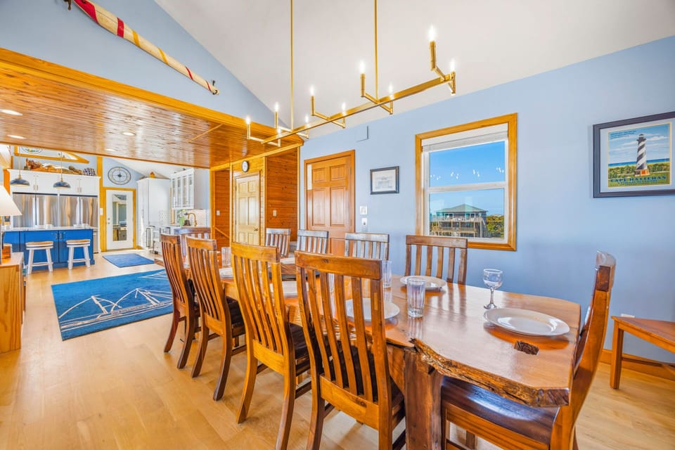 Gather around your spacious dining table for memorable meals with loved ones in this warm, nautical-inspired space.
