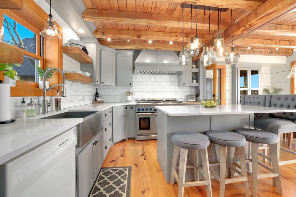 Stainless steel apron sink and custom cabinets in the kitchen