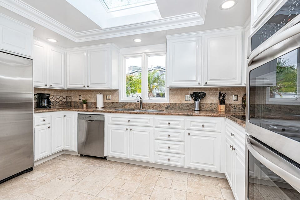 The kitchen comes stocked with dishes, utensils, cookware, bakeware, and all major appliances.
                