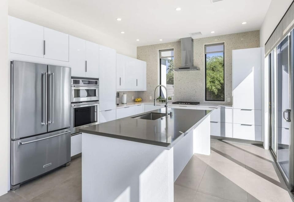 Fully stocked kitchen with large island and brand-new appliances—ideal for hosting.