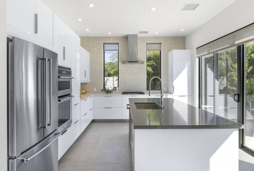 Fully stocked kitchen with large island and brand-new appliances—ideal for gatherings.