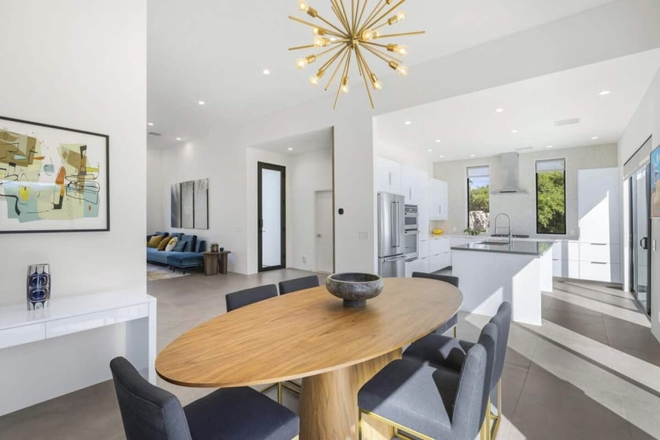Stylish dining space with designer lighting and an airy open-concept floor plan.