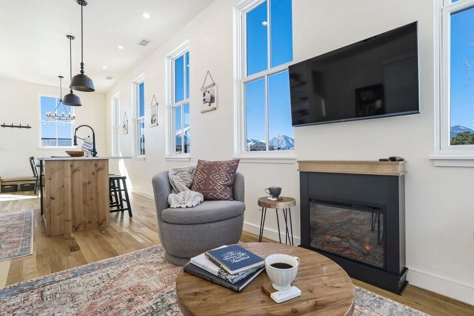 Welcome to Alpine Estate! Enjoy TV while you are warming up  and getting cozy by the Fireplace.