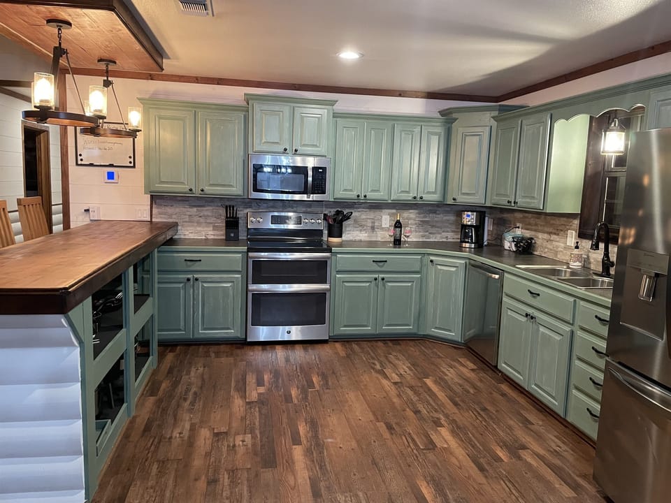 Green with envy cabinets brightens this space up!