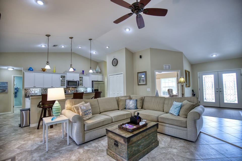 Large open concept living room and large sofa seats 5+ easily for viewing 65" TV