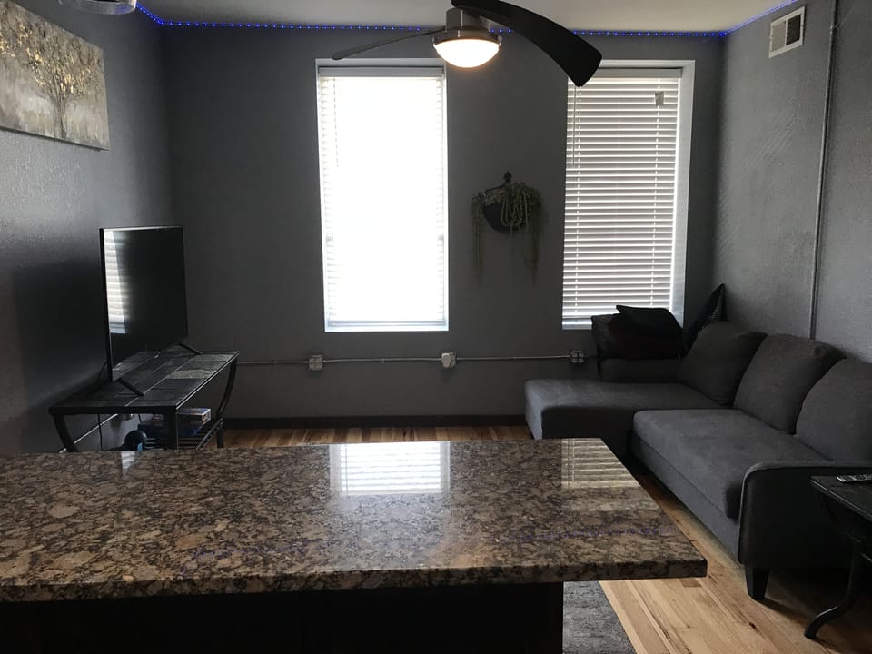Kitchen with bar for dining area or office use. 