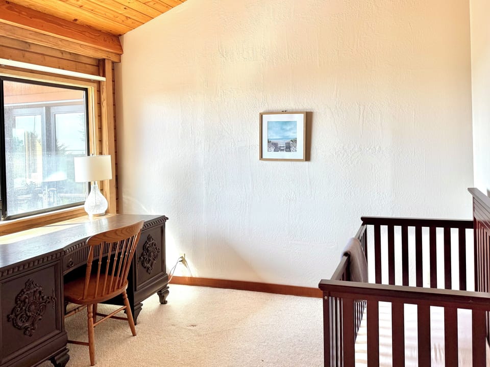 Crib and desk. (With ocean views)