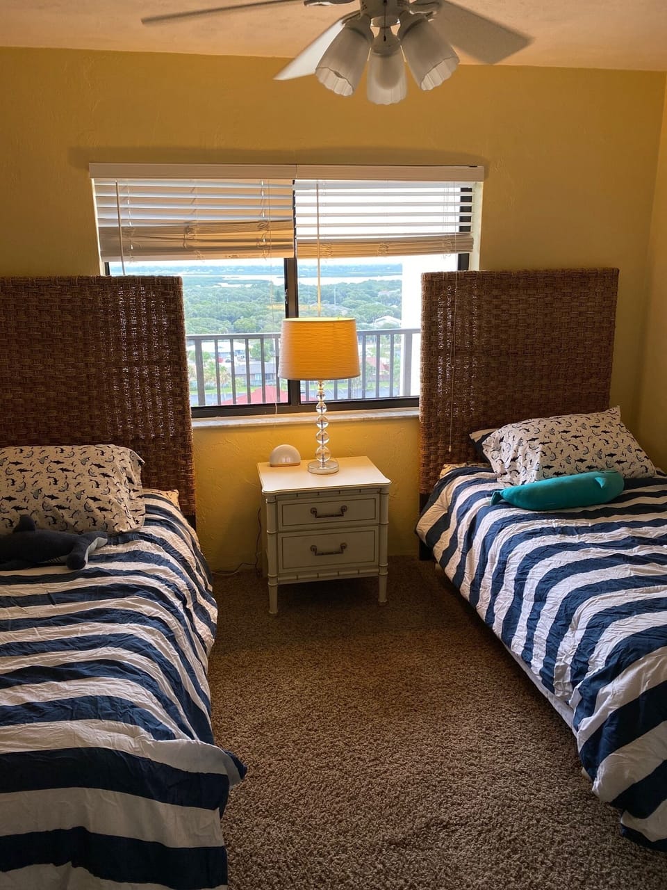 Guest bedroom looks out on the intracoastal waterway and lagoon.